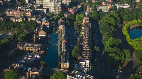 Slow Revealing Aerial View Shot of London UK, London Skyline, Square Mile, The City, United Kingdom, sunny soft