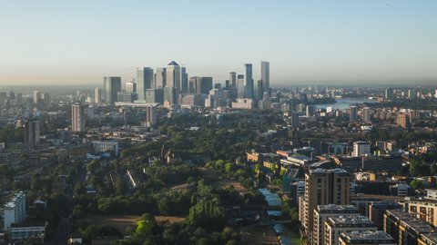 Aerial View Shot of London UK, Mile End Park & Financial District in the background, East London, United Kingdom, sunny morning