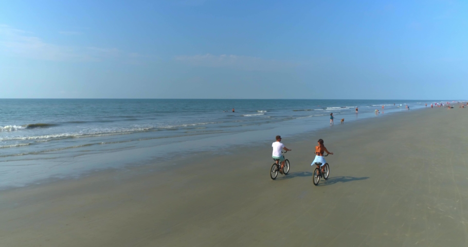 Young Couple Biking on Beach, Aerial Drone, 4K Royalty-Free Stock Footage #1062826243