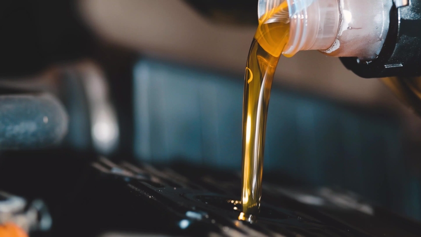 new engine oil is poured into the engine. replacement of technical fluids of the car. Royalty-Free Stock Footage #1062837022
