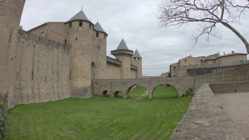 The Chateau Comtal - entrance from the Cite of Carcassonne, France. The chateau of the Counts of Carcassonne and the ramparts, a UNESCO World Heritage site located at the heart of the fortified city.