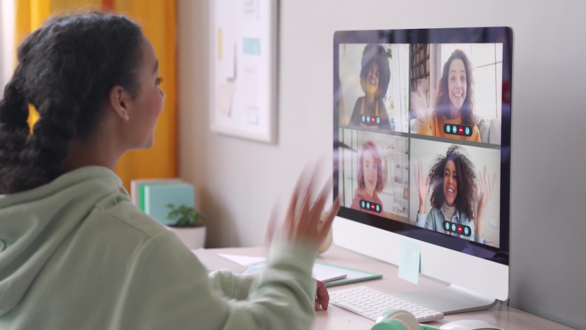 African american teenage girl chatting with happy multiethnic diverse teen friends during online virtual chat video call in group conference distance chat virtual meeting using computer at home. Royalty-Free Stock Footage #1062840187