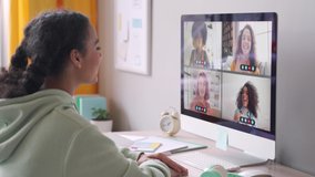 African american teenage girl chatting with happy multiethnic diverse teen friends during online virtual chat video call in group conference distance chat virtual meeting using computer at home. - Powered by Shutterstock - Get 15% off with code: PIKWIZARD15