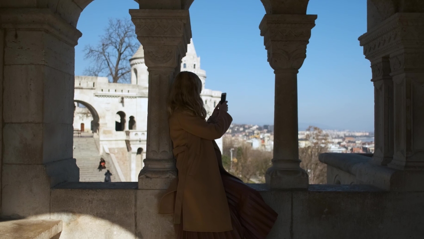 woman photographs view in the fishing bastion Budapest