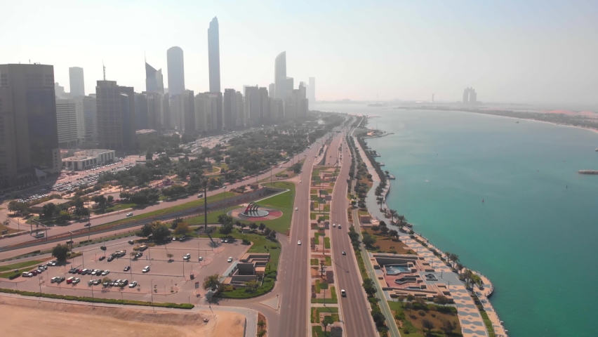Aerial tilt up revealshot of the skyline of Abu Dhabi