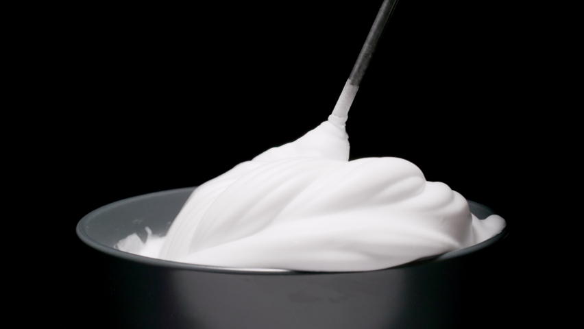 Whipped cream. White gentle cream whipping with mixer. Royalty-Free Stock Footage #1062865621