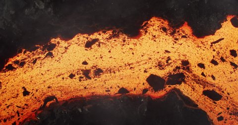 Amazing molten lava stream in slow motion. flowing liquid magma lava in 4K