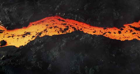 Beautiful hot molten lava stream river  in slow motion. flowing liquid magma lava in 4k