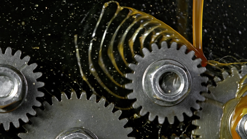 Super Slow Motion Shot of Gear Mechanism and Oil on Dark Background at 1000 fps. | Shutterstock HD Video #1062867940