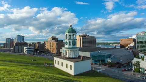 Halifax, NS Canada : 2014 Aug 05 -Town clock or Citadel Clock Tower, an historic landmark of Halifax. Background of prominent business finance and residential buildings downtown, Nova Scotia. 