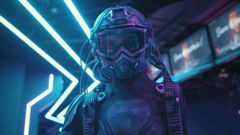 Female soldier of future in fiction helmet holding assault gun in her hands lit with blue neon street lights. Woman combat cyborg in futuristic protective costume. Cyberpunk warrior at night
