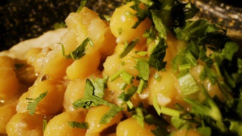 hummus dish with chickpeas, parsley.macro shot 4k 