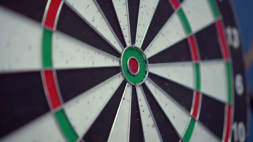Darts in bull's eye close up. Darts arrows in the target center business goal concept. Royalty-Free Stock Footage #1062895063