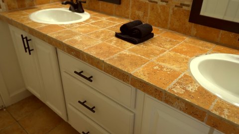 Interior bathroom design - cabinets and countertop of tiles. Construction, renovation, repair apartment. Modern bathroom. Bathroom vanity cabinet.