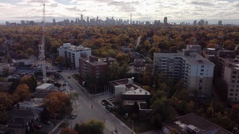 A drone flyover of Toronto's prestigious Forest Hill neighbourhood with a view of the Toronto skyline.