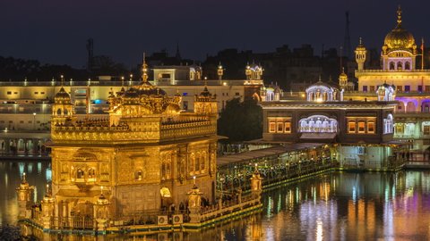 Day to night time lapse view of thousands of Sikh pilgrims visiting the Golden Temple aka Harmandir Sahib in Amritsar, Punjab, India. 