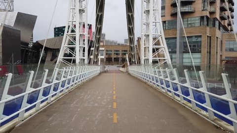 MANCHESTER, UK - 2020: Salford Quays Media City footbridge in Manchester UK