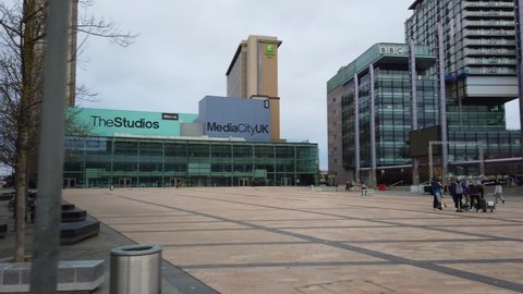 MANCHESTER, UK - 2020: Media City Manchester studios with BBC buildings and filmmakers 
