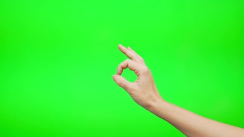 The Woman Gestures With Her Hand OKAY OK CLASS Everything is Good on a Green Background, Green Screen, Chroma Key, Alpha Channel, Close-up.
