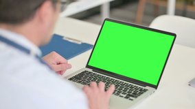 Middle Aged Male Doctor using Laptop with Chroma Screen  - Powered by Shutterstock - Get 15% off with code: PIKWIZARD15