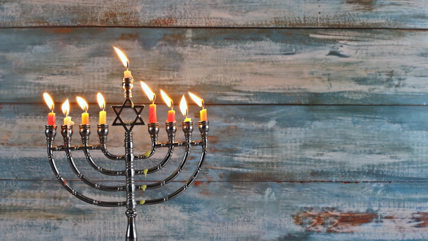 Hanukkah candles celebrating menorah with all candles burning. Royalty-Free Stock Footage #1062946000