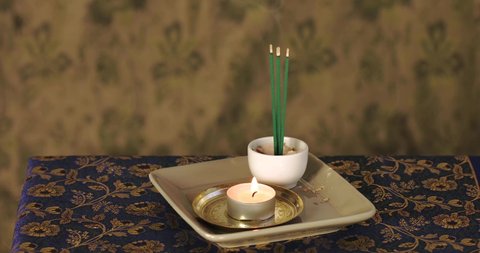 Arrangement with candle and joss sticks. Meditation, relaxation spiritual celebration. Home altar.