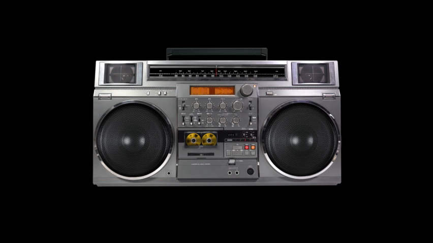 Retro music black background with radio boombox playing a golden cassette tape. Seamless loop | Shutterstock HD Video #1062948526