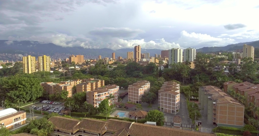 Beautiful Medellín, Antioquia, Colombia Cityscape with Houses, Buildings, Towers and Lots of Trees on a Cloudy Day
