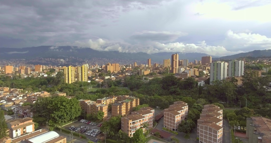 Beautiful Medellín, Antioquia, Colombia Cityscape with Houses, Buildings, Towers and Lots of Trees on a Cloudy Day