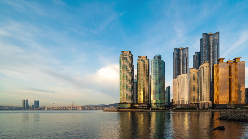 Timelapse 4K skyline of Busan city as viewed from across the sea popular Destinations in Busan,South Korea