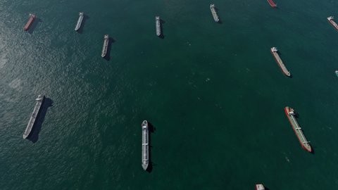 Aerial view of cargo vessels. 
 Container  ships, oil and chemical tankers carrying cargo and running for export goods. 3D rendering animation.