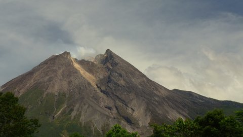 Timelapse of merapi volcano crater emitting smoke, a state of alert will eruption, Indonesian Mountain