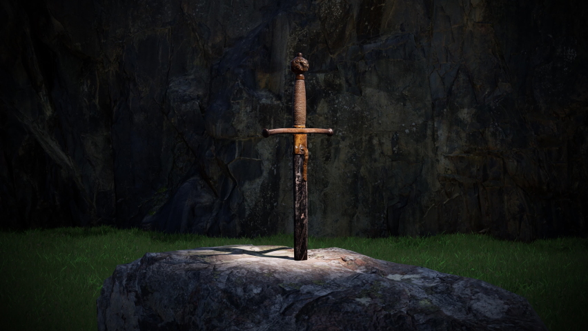 A close-up view of the sword in the stone as viewed under a spotlight at night.