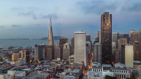 San Francisco skyline and city lights timelapse during sunset, California, USA