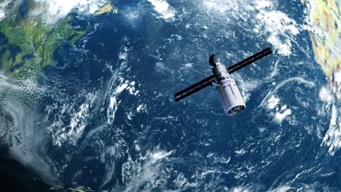 artificial satellite of the earth. a satellite flying in space over the globe
