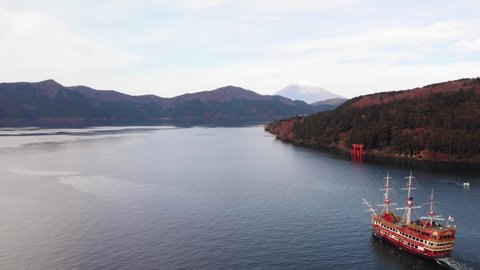 Flying over a pirate ship on Lake Ashi near the historic Hakone Torii Gate with Mount Fuji in the background