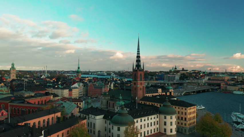 Aerial drone footage of Stockholm City flying past Riddarholmen church Royalty-Free Stock Footage #1063003384
