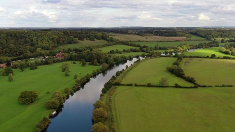 Aerial above The River Thames flowing through countryside near Reading, Berkshire, UK