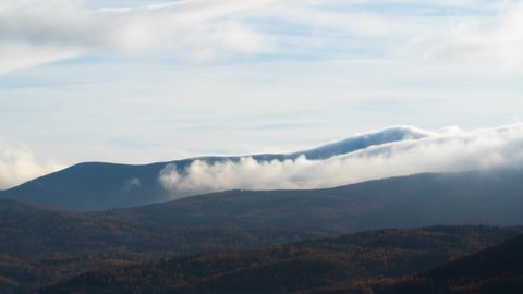 Time lapse of clouds flowing over the beautiful Sniezka mountain in Karkonosze, Poland