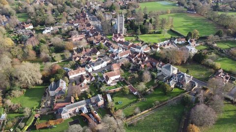 A drone flight over Dedham on the EssexSuffolk border towards the church with views of the whole village and surrounding countryside including the High Street.