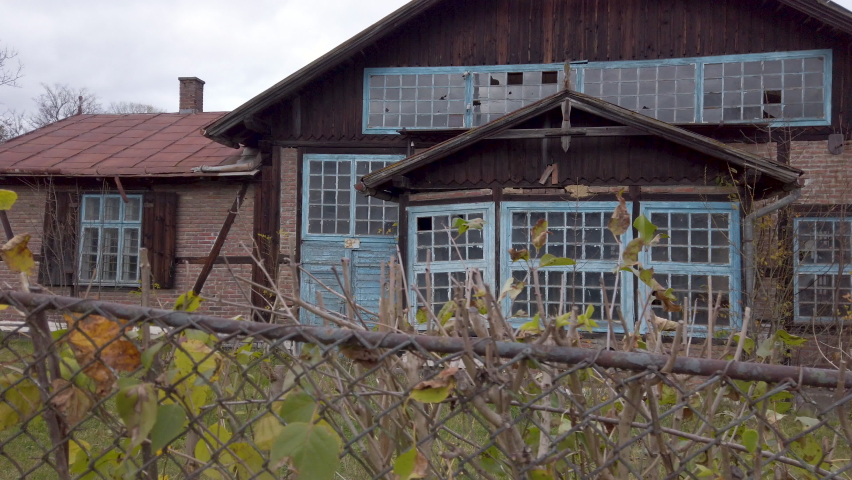Slide view on an ancient manufacture building in a countryside. Old building in a village. 