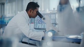 Medical Research Laboratory: Focus Shifting from Female Scientist Working to Male Scientist Looking Under Micrsocope. Advanced Scientific Lab Biotechnology, Medicine, Microbiology, Drugs Development - Powered by Shutterstock - Get 15% off with code: PIKWIZARD15