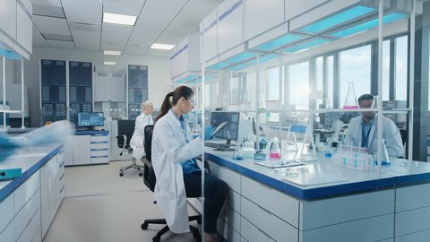 Time-Lapse in Modern Medical Research Laboratory: Team of Scientists Working Using Microscope, Analysing Microbiology Samples. Scientific Lab for Medicine, Biotechnology Development Dolly Shot