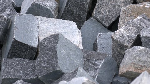Storage blocks of granite in a quarry for sale. Rough granite blocks for construction industry. Granite block on a mine quarry  
