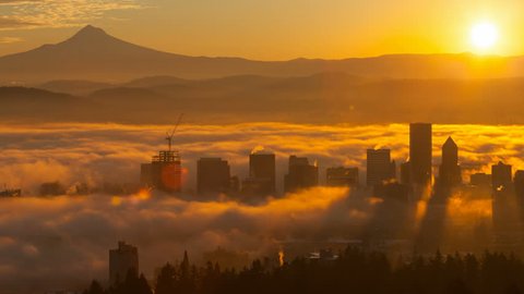Ultra High Definition 4k Time Lapse Movie of Rolling Fog Low Clouds and Sky with Snow Covered Mount Hood Over Downtown Cityscape of Portland Oregon at Sunrise One Early Morning 4096×2160