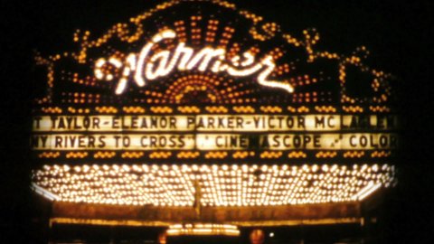 TRENTON, NEW JERSEY, SEPTEMBER, 1956: A fancy old neon marquee sign flashing at the local theatre in the Fall of 1956.