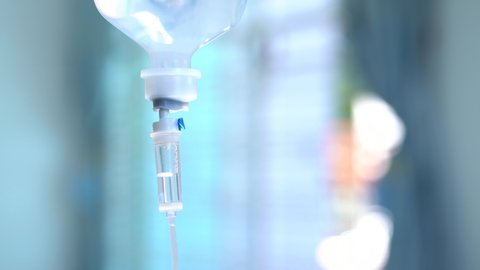 4K. Closeup of IV drip in hospital, Intravenous saline solution, IV loading dose.