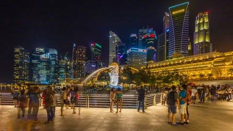 Singapore City, Singapore - 20 November 2016: Timelapse of Cityscape view with sunset and twilight time main light color showplaces, view marina bay and merlion landmark