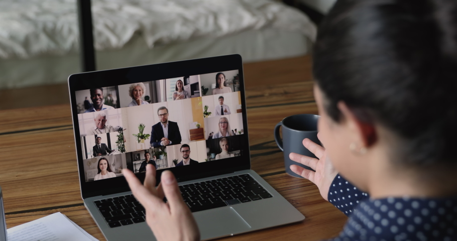Focus on computer screen with diverse business people involved in video call online meeting, skilled colleagues discussing project ideas with leader at virtual conference event, modern tech concept. | Shutterstock HD Video #1063058911