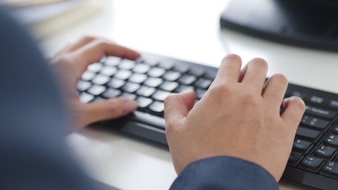 Closeup business people hands typing on keyboard computer desktop for using internet, searching data, working, writing email.